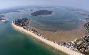 An aerial view of Poole Harbour with Sandbanks Beach, Dorset // Kiterr.com