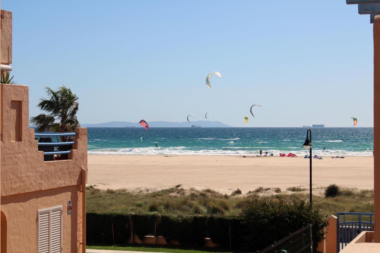 Kitesurfers riding at Los Lances Beach in Tarifa, Spain