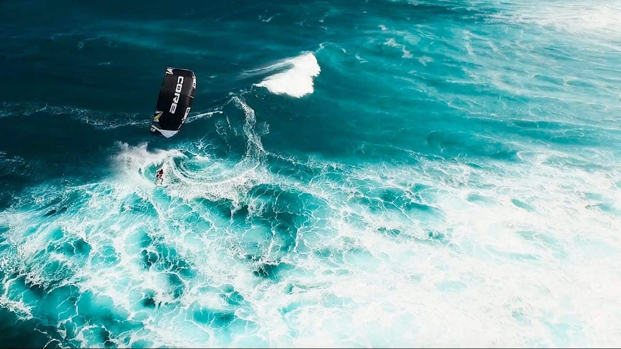 A kitesurfer riding a wave in Hookipa Beach, Maui // Kiterrcom