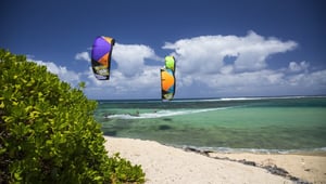 Two kitesurfers riding in Cabarete, Dominican Republic